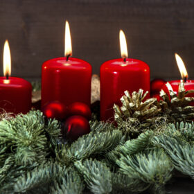 advent decoration with four red burning candles