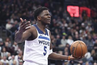 Minnesota Timberwolves guard Anthony Edwards reacts after a play against the Utah Jazz during the first quarter of an NBA basketball game, Thursday, Jan. 30, 2025, in Salt Lake City. (AP Photo/Rob Gray)