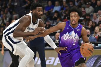 Utah Jazz guard Collin Sexton (2) handles the ball against Memphis Grizzlies forward Jaren Jackson Jr. in the first half of an NBA basketball game, Saturday, Jan. 25, 2025, in Memphis, Tenn. (AP Photo/Brandon Dill)