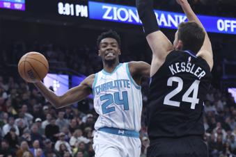 Charlotte Hornets forward Brandon Miller (24) goes to the basket against Utah Jazz center Walker Kessler (24) during the second quarter of an NBA basketball game, Wednesday, Jan. 15, 2025, in Salt Lake City. (AP Photo/Rob Gray)