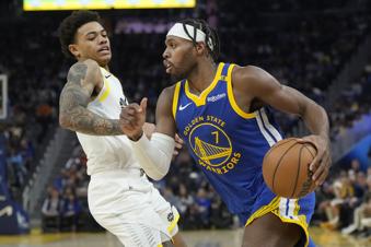 Golden State Warriors guard Buddy Hield (7) drives to the basket against Utah Jazz guard Keyonte George during the first half of an NBA basketball game in San Francisco, Tuesday, Jan. 28, 2025. (AP Photo/Jeff Chiu)