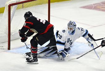 Ottawa Senators' Claude Giroux (28) scores against Utah Hockey Club goaltender Karel Vejmelka (70) during third-period NHL hockey game action in Ottawa, Ontario, Sunday, Jan. 26, 2025. (Justin Tang/The Canadian Press via AP)