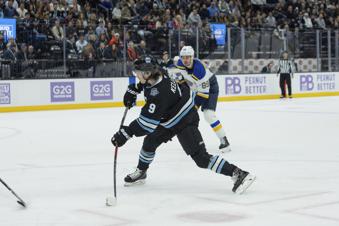 Utah Hockey Club center Clayton Keller (9) shoots the puck against St. Louis Blues left wing Pavel Buchnevich (89) during the first period of an NHL hockey game Saturday, Jan. 18, 2025, in Salt Lake City. (AP Photo/Melissa Majchrzak)