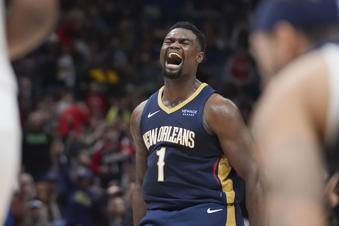 New Orleans Pelicans forward Zion Williamson (1) reacts after his alley-oop slam dunk in the second half of an NBA basketball game against the Utah Jazz in New Orleans, Friday, Jan. 17, 2025. (AP Photo/Gerald Herbert)