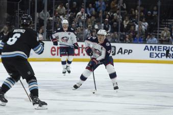 Columbus Blue Jackets center Cole Sillinger (4) skates with the puck against Utah Hockey Club defensemen John Marino (6) during the second period of an NHL hockey game Friday, Jan. 31, 2025, in Salt Lake City. (AP Photo/Melissa Majchrzak)