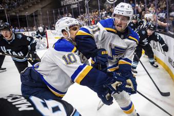 St. Louis Blues center Dylan Holloway (81) and St. Louis Blues center Brayden Schenn (10) trail Utah Hockey Club left wing Matias Maccelli (63) for possession of the puck during an NHL hockey game in Salt Lake City, Sunday, Feb. 2, 2025. (Tess Crowley/The Deseret News via AP)