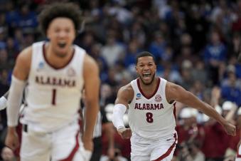 Alabama guard Chris Youngblood (8) and guard Mark Sears (1) react during the second half of a Sweet 16 round NCAA college basketball tournament game against Brigham Young, Thursday, March 27, 2025, in Newark, N.J. (AP Photo/Frank Franklin II)