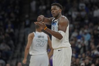 Minnesota Timberwolves guard Anthony Edwards (5) gestures after making a shot during the first half of an NBA basketball game against the Utah Jazz, Sunday, March 16, 2025, in Minneapolis. (AP Photo/Abbie Parr)