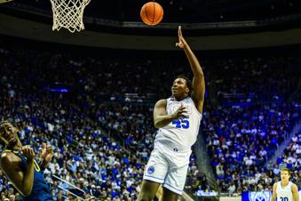 BYU center Fousseyni Traore shoots and scores during the first half of an NCAA basketball game against West Virginia, Saturday, March 1, 2025, in Provo, Utah. (AP Photo/Tyler Tate)
