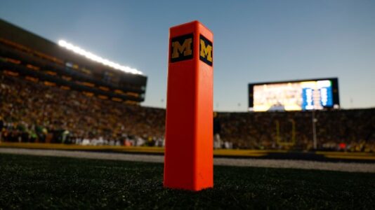 Former University of Michigan football coach indicted for hacking accounts, downloading ‘intimate’ photos