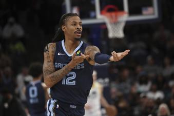 Memphis Grizzlies guard Ja Morant (12) celebrates in the first half of an NBA basketball game against the Utah Jazz, Wednesday, March 12, 2025, in Memphis, Tenn. (AP Photo/Nikki Boertman)