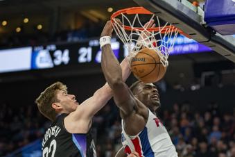 Detroit Pistons center Jalen Duren, right, dunks as Utah Jazz forward Kyle Filipowski, left, defends during the first half of an NBA basketball game Monday, March 3, 2025, in Salt Lake City. (AP Photo/Rick Egan)