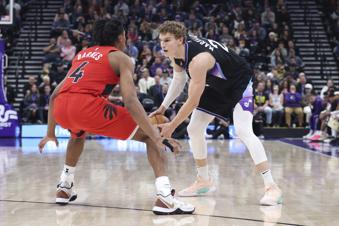 Utah Jazz forward Lauri Markkanen (23) looks for a play against Toronto Raptors forward Scottie Barnes (4) during the first half of an NBA basketball game, Friday, March 14, 2025, in Salt Lake City. (AP Photo/Rob Gray)