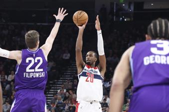 Washington Wizards forward Alex Sarr (20) shoots over Utah Jazz forward Kyle Filipowski (22) during the first half of an NBA basketball game, Wednesday, March 19, 2025, in Salt Lake City. (AP Photo/Rob Gray)