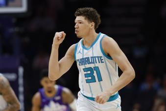 Charlotte Hornets forward Tidjane Salaun reacts after hitting a 3-point basket against the Utah Jazz during the first half of an NBA basketball game in Charlotte, N.C., Monday, March 31, 2025. (AP Photo/Nell Redmond)