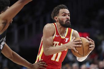 Atlanta Hawks guard Trae Young (11) drives to the basket during the first half of an NBA basketball game against the Utah Jazz, Sunday, April 6, 2025, in Atlanta. (AP Photo/Colin Hubbard)