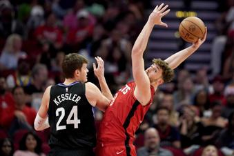Houston Rockets center Alperen Sengun, right, grabs a rebound over Utah Jazz center Walker Kessler during the second half of an NBA basketball game Wednesday, April, 2, 2025, in Houston. (AP Photo/Eric Christian Smith)