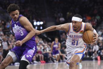 Oklahoma City Thunder guard Aaron Wiggins (21) goes to the basket against Utah Jazz guard Keyonte George (3) during the first half of an NBA basketball game, Friday, April 11, 2025, in Salt Lake City. (AP Photo/Rob Gray)