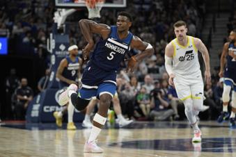 Minnesota Timberwolves guard Anthony Edwards (5) gestures after making a 3-point shot during the first half of an NBA basketball game against the Utah Jazz, Sunday, April 13, 2025, in Minneapolis. (AP Photo/Abbie Parr)