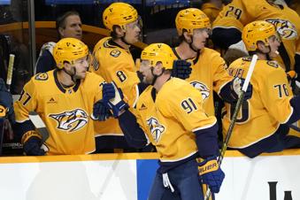Nashville Predators center Steven Stamkos (91) is congratulated after scoring a goal against the Montreal Canadiens during the first period of an NHL hockey game Sunday, April 6, 2025, in Nashville, Tenn. (AP Photo/Mark Humphrey)