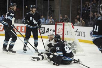 Los Angeles Kings right wing Adrian Kempe (9) fights with Utah Hockey Club center Logan Cooley (92) during the second period of an NHL hockey game, Thursday, April 3, 2025, in Salt Lake City. (AP Photo/Melissa Majchrzak)