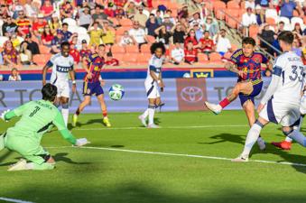 Real Salt Lake midfielder Diego Luna, second from right, shoots and scores against Vancouver Whitecaps goalkeeper Yohei Takaoka (1) during the first half of an MLS soccer match Saturday, May 24, 2025, in Sandy, Utah. (AP Photo/Tyler Tate)