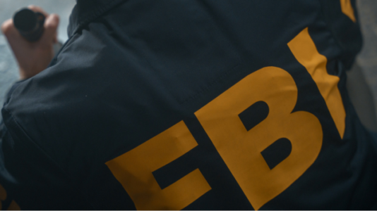 Suspect sought after car rams FBI gate in potential ‘act of terror,’ official says